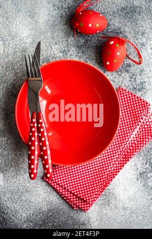 Red Easter place setting on a table Stock Photo