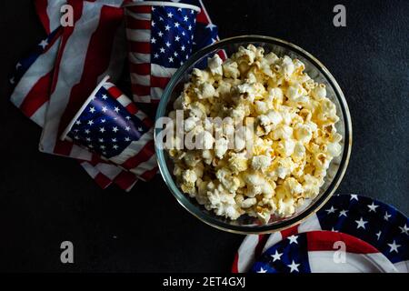 Bowl of popcorn with Independence Day flags, cups and plates Stock Photo