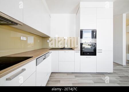 modern white kitchen with built-in appliances Stock Photo