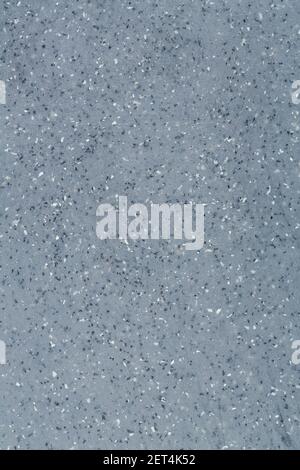 Gray plastic texture with spots as a background, horizontal image. Stock Photo