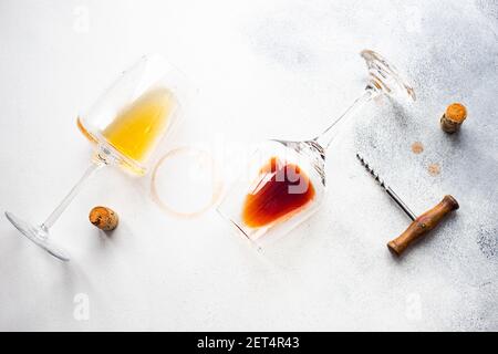 Overhead view of wine glasses with saperavi and rkatseteli wine next to corks and a corkscrew Stock Photo