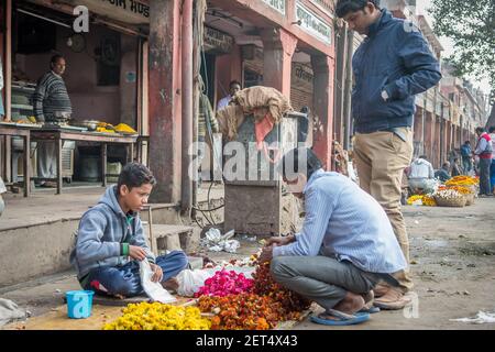 Jaipur, India. 09-05-2018. Boy adolescent selling flowers on the streets of Jaipur in the Rajasthan in the local market. Stock Photo