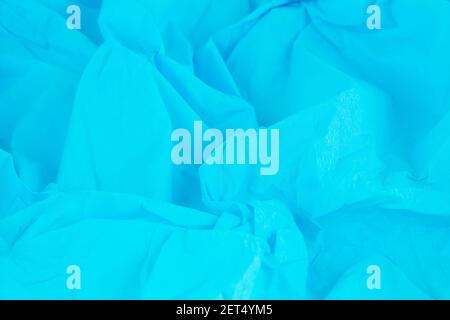 Crumpled blue crepe paper texture as a background. Stock Photo