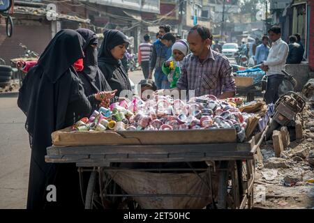 Jaipur, India. 09-05-2018. Women are buying bracelets from a man in the local market in the center of Jaipur. Stock Photo