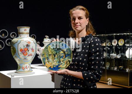 A auction assistant poses with an Urbino Maiolica istoriato dish, possible the workshop of Guido Durantino (Guido Fontana) Dated 1541. Estimate £ 20,000 - 30,000 at Bonhams in New Bond Street London, UK on December 3, 2018. (Claire Doherty/Sipa USA)