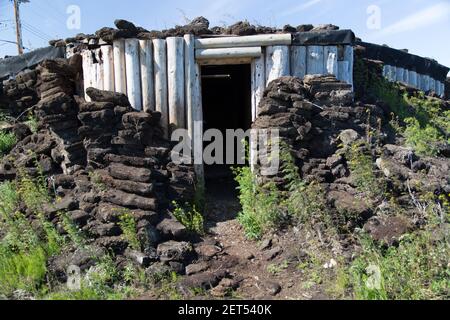 Underground icehouse (community freezer) built deep in the permafrost, in the Inuvialuit hamlet of Tuktoyaktuk, Northwest Territories, Canada's Arctic Stock Photo