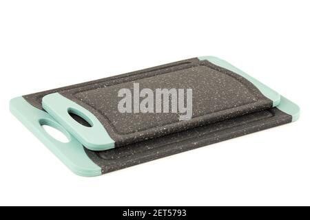 Two black plastic cutting boards isolated on white background. Stock Photo