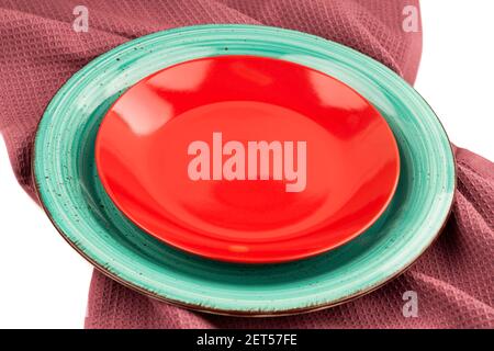 Two colorful empty plates on the cotton towel. Stock Photo