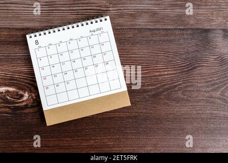 August Desk Calendar 2021 on Top of Wooden Background Stock Photo