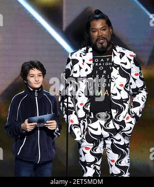 LOS ANGELES - DECEMBER 6: Presenters Sunny Sulijic and Christopher Judge  appear onstage at the 2018 Game Awards at the Microsoft Theater on December  6, 2018 in Los Angeles, California. (Photo by