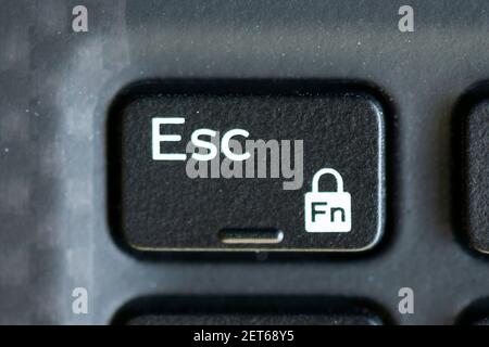 Escape and function lock key on a laptop keyboard Stock Photo