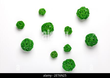 Green decorative rattan ball, Spanish cane, calamus stems. Chaotic wicker ball or circle shape. An isolated group of set object items on white backgro Stock Photo