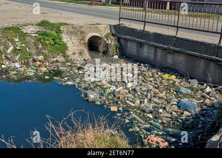 Zrenjanin, Serbia, March 01, 2021. Picture of human negligence and ecological catastrophe on the canal with water and its surroundings. Every life in Stock Photo