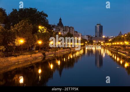 Bucharest on Dambovita river, Romania in a summer night Stock Photo