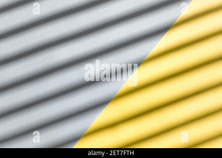 Abstract background from yellow and gray color with diagonal shadows on it Stock Photo