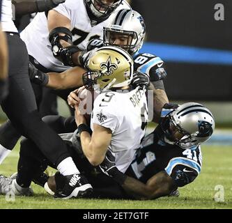 Carolina Panthers cornerback Captain Munnerlyn (41) is checked by Carolina  Panthers medical staff after getting hit during an NFL football game  Tennessee Titans in Charlotte, N.C., Sunday Nov.13, 2011. (AP Photo/Mike  McCarn