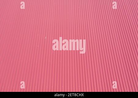 Aerial view of burgundy coloured corrugated iron roof panels Stock Photo