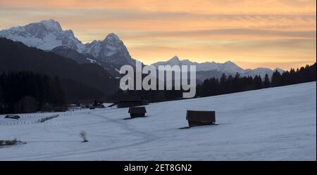 sunset in the mountains - wooden huts and sahara sand creating epic atmosphere Stock Photo