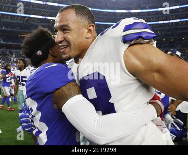 New York Giants cornerback Donte' Deayon (38) and Dallas Cowboys linebacker  Leighton Vander Esch (55) talk after the game on Sunday, Sept. 16, 2018, at  AT&T Stadium in Arlington, Texas. (Photo by