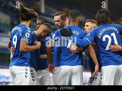 Everton's Richarlison (second left) celebrates scoring their side's first goal of the game with team-mates during the Premier League match at Goodison Park, Liverpool. Picture date: Monday March 1, 2021. Stock Photo