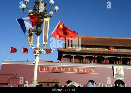 --FILE--Chinese and French national flags flutter on a lamppost in front of the Tian'anmen Rostrum during the visit of French President Emmanuel Macron in Beijing, China, 8 January 2018. The French president's diplomatic counselor Emmanuel Bonne will visit China on July 19 to hold a new round of consultation between the coordinators for the China-France Strategic Dialogue, Foreign Ministry spokesperson Geng Shuang announced Monday (15 July 2019). Bonne will be visiting at the invitation of State Councilor and Foreign Minister Wang Yi, Geng said at a press briefing (Photo by Hu qingming - Imagi
