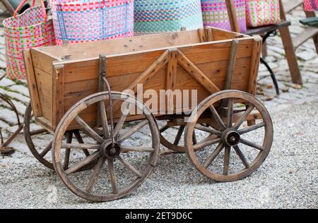 Antique wooden wheelbarrow on a farm Stock Photo