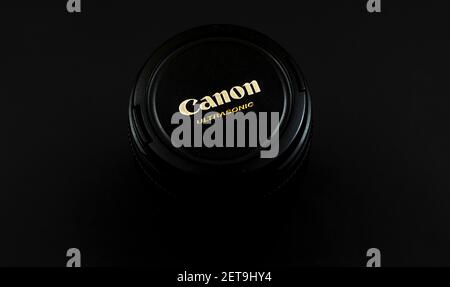 Kharkov,Ukraine - February 24, 2021: Canon ultrasonic lens cup brand logo, black background photo Stock Photo