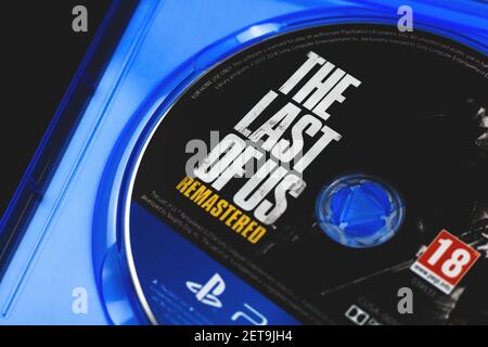 Kharkov,Ukraine - February 24, 2021: The last of Us logo close up, game for PS4 console, disc Stock Photo