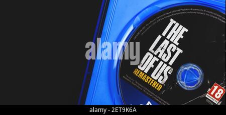 Kharkov, Ukraine - February 24, 2021: The last of Us PS4 disc game logo close up, banner photo Stock Photo