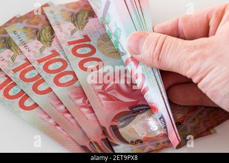 Converted 100 dollar bills from New Zealand. Stock Photo