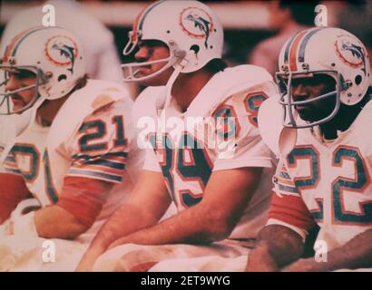 A photograph on display of former Miami Dolphins running back Jim Kiick,  full back Larry Csonka, center, and running back Mercury Morris, right, at  Independence Hall assisted living facility in Wilton Manors,
