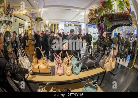 Shoppers browse Coach handbags in the Macy's Herald Square flagship store  on Sunday, March 26, 2017. Tapestry, the owner of the Coach and Kate Spade  brands, announced that revenue per handbag rose
