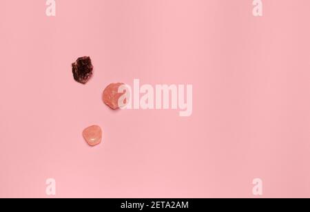 creative minimal layer with ornamental stones on pink Stock Photo