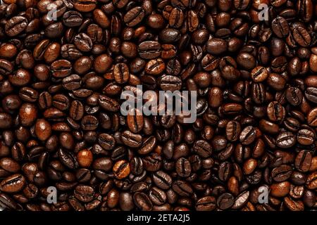 Creative backdrop made of coffee beans. Love coffee concept. Stock Photo