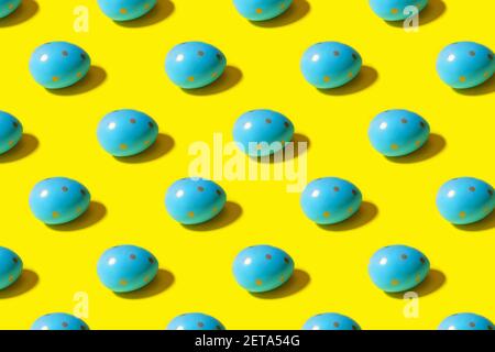 Easter seamless pattern. Blue painted egg on a yellow background. Creative packaging design in the concept of minimalism Stock Photo