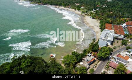 Aerial view of Karang Bolong Beach and Its Wonderful Sunset View. At anyer beach with noise cloud and cityscape. Banten, Indonesia, March 3, 2021 Stock Photo