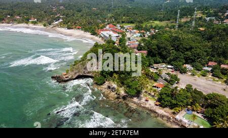 Aerial view of Karang Bolong Beach and Its Wonderful Sunset View. At anyer beach with noise cloud and cityscape. Banten, Indonesia, March 3, 2021 Stock Photo