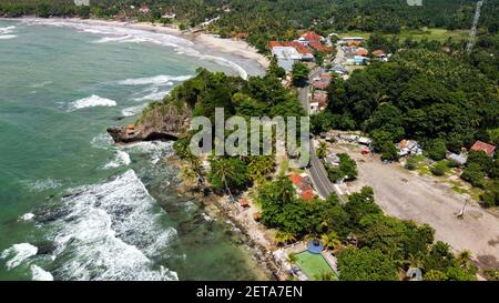 Aerial view of Karang Bolong Beach and Its Wonderful Sunset View. At anyer beach with noise cloud and cityscape. Banten, Indonesia, March 3, 2021 Stock Photo