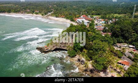 Aerial view of Karang Bolong Beach and Its Wonderful Sunset View. At anyer beach with noise cloud and cityscape. Banten, Indonesia, March 3, 2021 Stock Photo