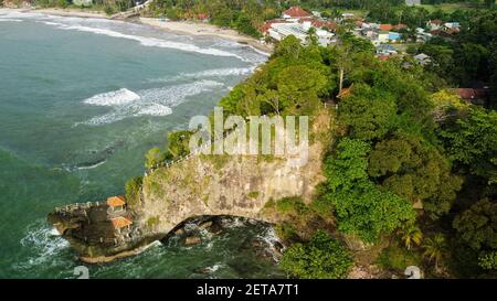 Aerial view of Karang Bolong Beach and Its Wonderful Sunset View. At anyer beach with noise cloud and cityscape. Banten, Indonesia, March 3, 2021 Stock Photo