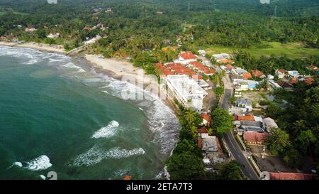 Aerial view of Karang Bolong Beach and Its Wonderful Sunset View. At anyer beach with noise cloud and cityscape. Banten, Indonesia, March 3, 2021 Stock Photo