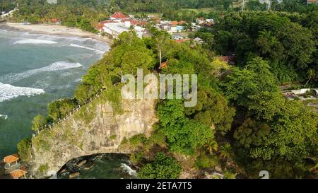 Aerial view of Karang Bolong Beach and Its Wonderful Sunset View. At anyer beach with noise cloud and cityscape. Banten, Indonesia, March 3, 2021 Stock Photo