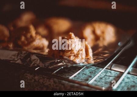 Shortbread pastry dough pieces laid out on the foil for baking Stock Photo