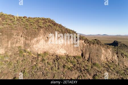 AGUILA, ARIZONA, UNITED STATES - Feb 20, 2021: Beneath a layer of lava is a limestone foundation on Eagle Eye Mountain near Aguila, Arizona. Stock Photo