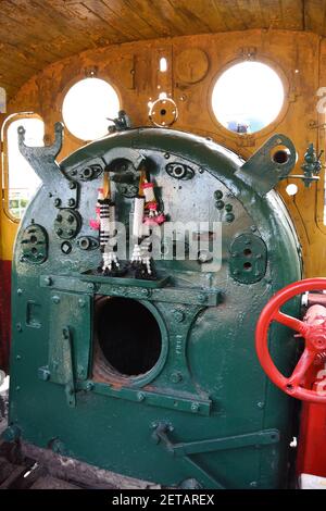 Boiler room in the old steam locomotive C56 15, built by Japanese, used during WW2 on the bridge over River Kwai, Kanchanaburi, Thailand. Stock Photo