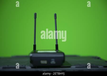 Close up view of wireless microphone receiver in chroma shooting studio. wireless receiver Stock Photo