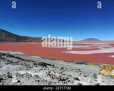 POTOS, BOLIVIA - Sep 07, 2018: Incredible red lagoon with blue sky Stock Photo