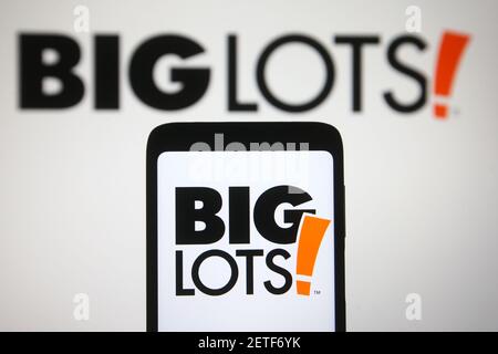 In this photo illustration the Big Lots logo of a US retail company is seen on a smartphone and a pc screen. Stock Photo