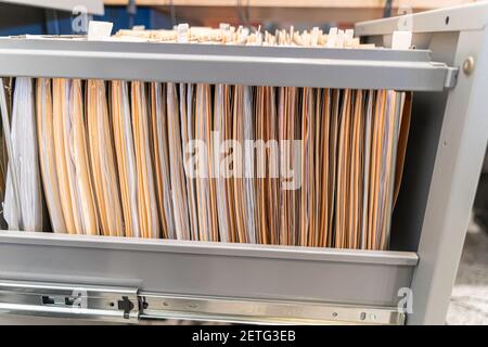 Hanging files in filling cabinet in an office Stock Photo