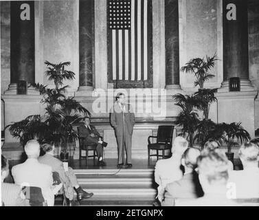 Photograph of Official Preview Freedom Train Exhibit- General Services Administration (GSA) Administrator Jess Larson speaking, Dr. Wayne C. Grover, Archivist of the United States, seated (18462090794). Stock Photo